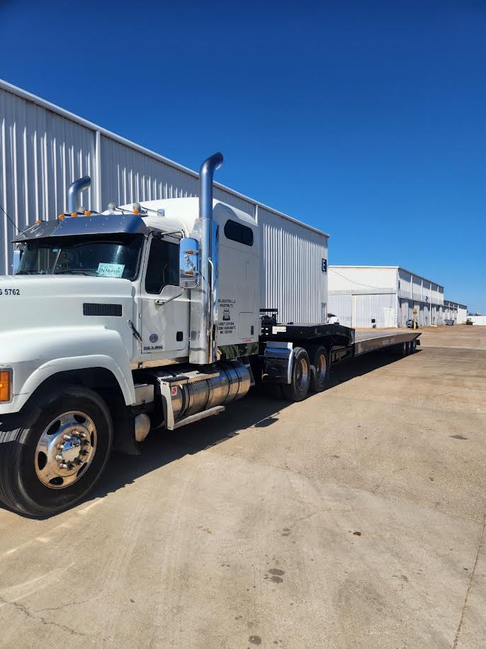 JDG Logistics Mack truck with flatbed trailer